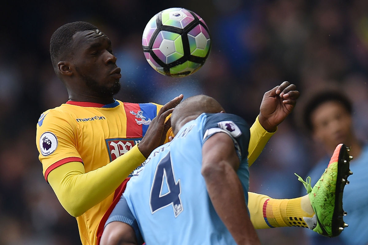 Crystal Palace's Zaire-born Belgian striker Christian Benteke (L) vies with Manchester City's Belgian defender Vincent Kompany during the English Premier League football match between Manchester City and Crystal Palace at the Etihad Stadium in Manchester, north west England, on May 6, 2017. / AFP PHOTO / Oli SCARFF / RESTRICTED TO EDITORIAL USE. No use with unauthorized audio, video, data, fixture lists, club/league logos or 'live' services. Online in-match use limited to 75 images, no video emulation. No use in betting, games or single club/league/player publications.  /         (Photo credit should read OLI SCARFF/AFP/Getty Images)