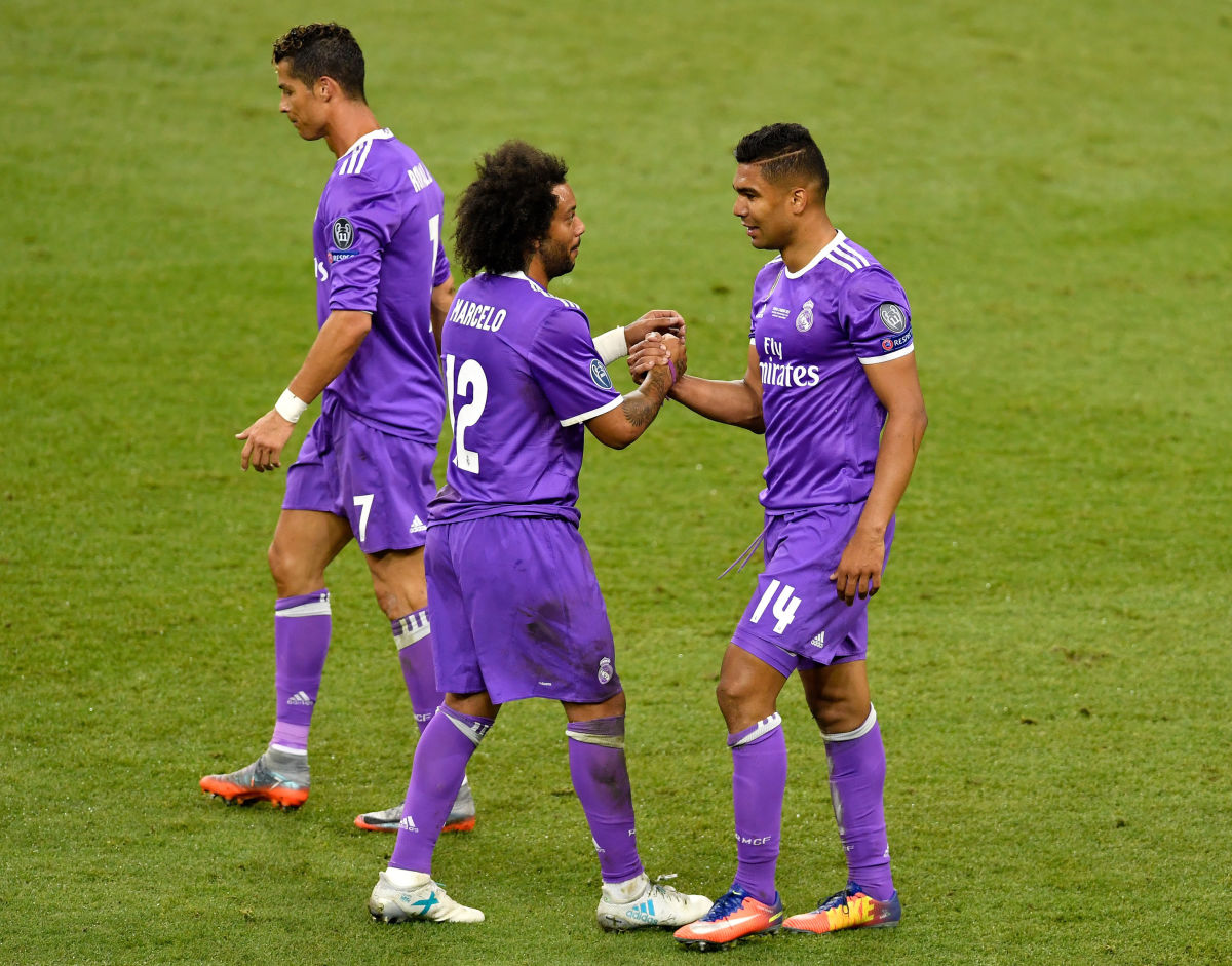 CARDIFF, WALES - JUNE 03:  In this handout image provided by UEFA, Casemiro (R) of Real Madrid celebrates his goal with team mate Marcelo during the UEFA Champions League Final between Juventus and Real Madrid at National Stadium of Wales on June 3, 2017 in Cardiff, Wales.  (Photo by Handout/UEFA via Getty Images)