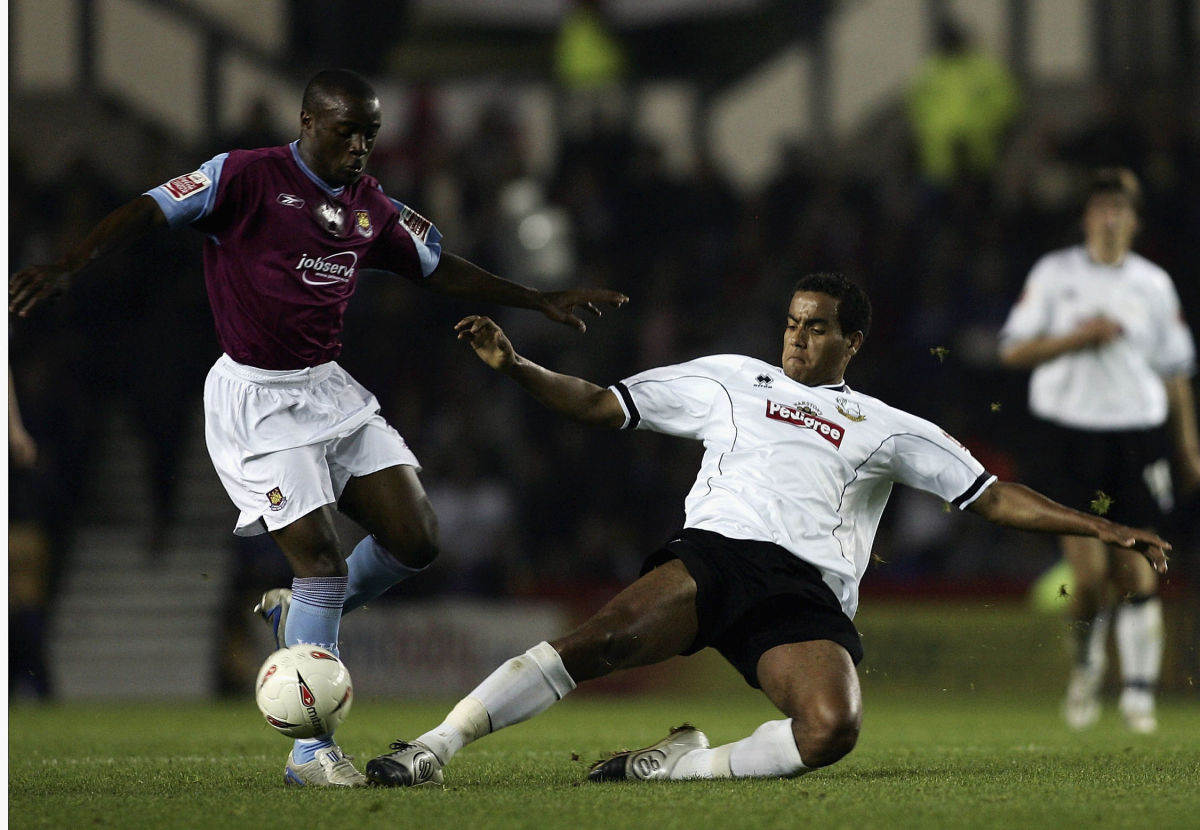 DERBY, ENGLAND - SEPTEMBER 29:  Tom Huddlestone of Derby challenges Nigel Reo-Coker of West Ham during the Coca-Cola Championship match between Derby County and West Ham United at Pride Park on September 29, 2004 in Derby, England.  (Photo by Mark Thompson/Getty Images)