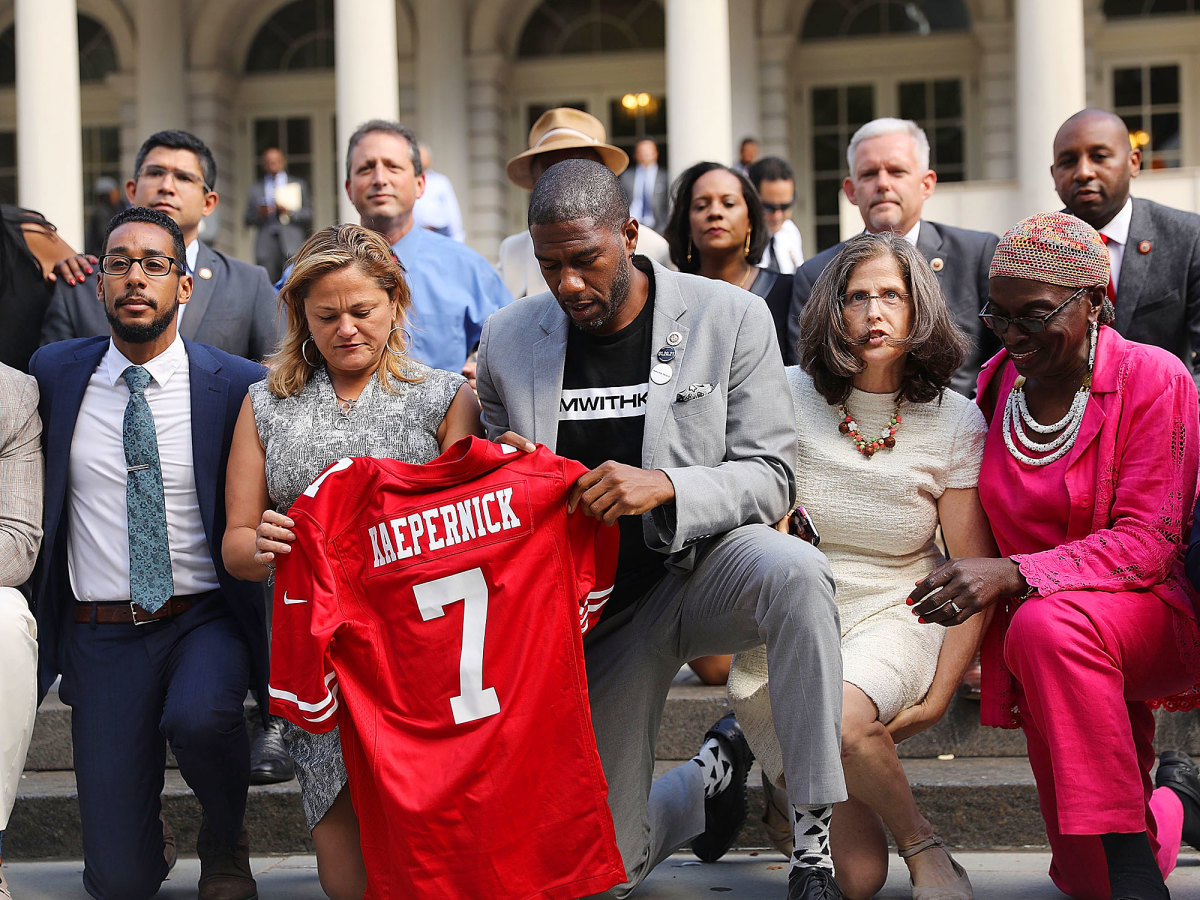 New York City Council members take a knee on the steps of City Hall after Donald Trump condemned the NFL players who choose to kneel. 