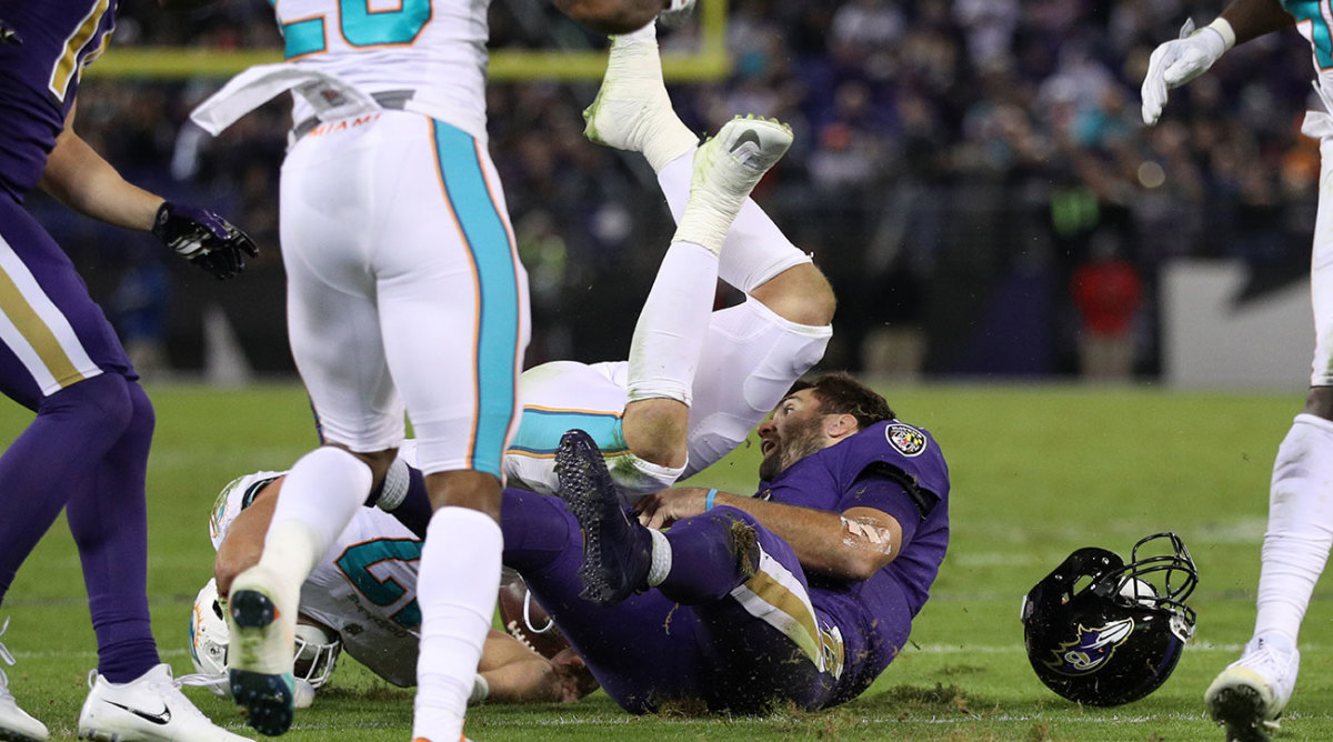 Joe Flacco left Thursday's game after being hit by Kiko Alonso.