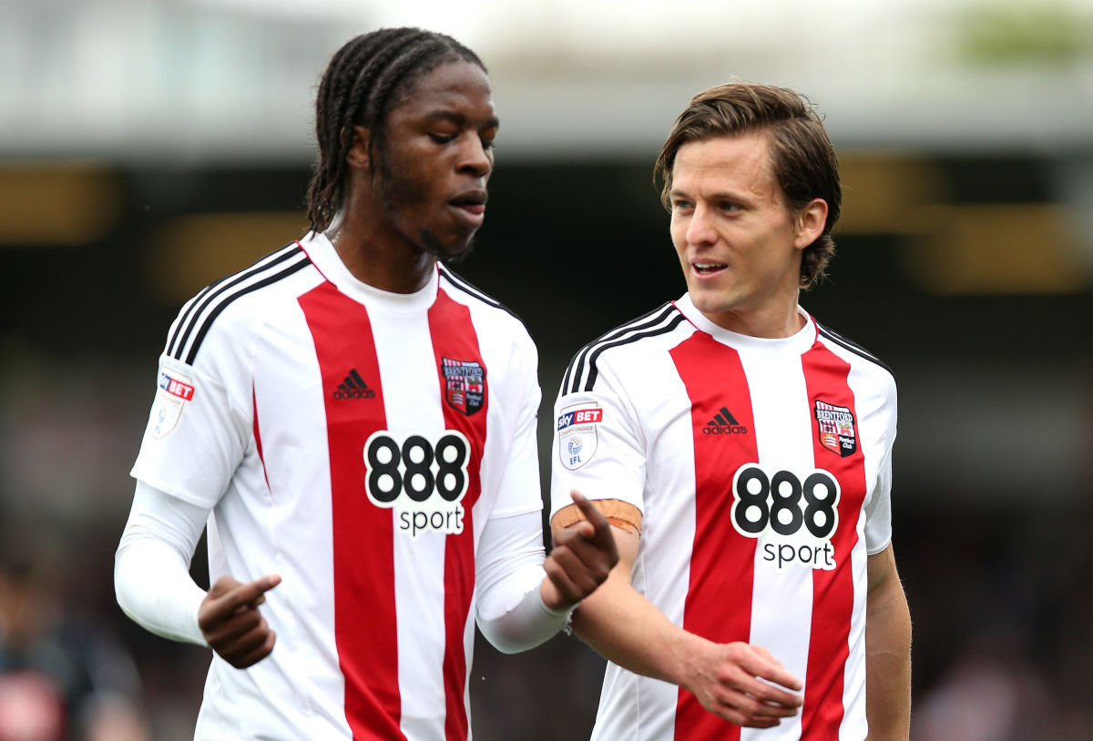 BRENTFORD, ENGLAND - APRIL 14: Romaine Sawyers of Brentford (L) speaks with Lasse Vibe of Brentford (R) during hald time in the Sky Bet Championship match between Brentford and Derby County at Griffin Park on April 14, 2017 in Brentford, England.  (Photo by Alex Pantling/Getty Images)