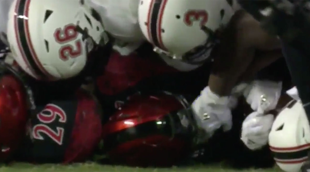 Rashaad Penny poked in eyes by Northern Illinois LB in dogpile
