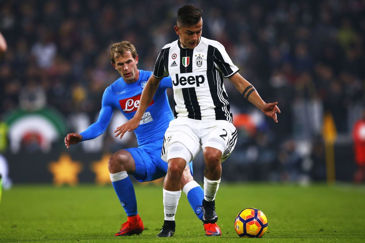 Napoli's Croatian defender Ivan Strinic (L) fights for the ball with Juventus' Argentinan forward Paulo Dybala during the Italian Tim Cup football match between Juventus and Napoli on February 28, 2017, at the Juventus Stadium in Turin. / AFP / Marco BERTORELLO        (Photo credit should read MARCO BERTORELLO/AFP/Getty Images)