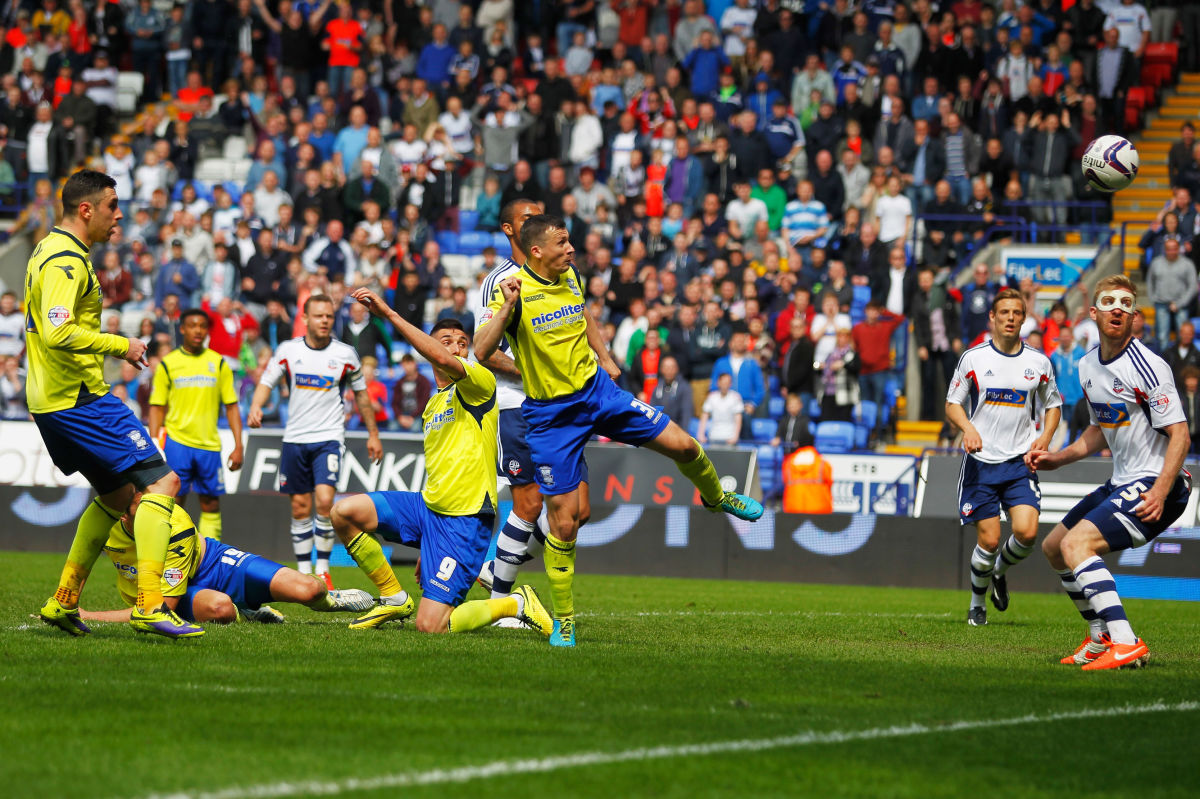 BOLTON, ENGLAND - MAY 03:  Paul Caddis of Birmingham City scores their second goal with a header to equalise during the Sky Bet Championship match between Bolton Wanderers and Birmingham City at Reebok Stadium on May 3, 2014 in Bolton, England.  (Photo by Paul Thomas/Getty Images)