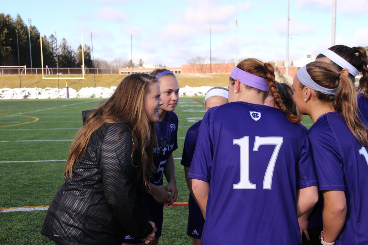 Coach Belichick chats with her players at a recent practice. 