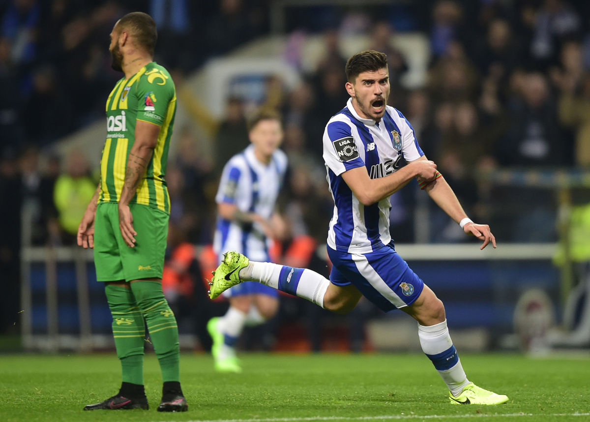Porto's midfielder Ruben Neves (R) celebrates after scoring during the Portuguese league football match FC Porto vs CD Tondela at the Dragao stadium in Porto on February 17, 2017. / AFP / MIGUEL RIOPA        (Photo credit should read MIGUEL RIOPA/AFP/Getty Images)