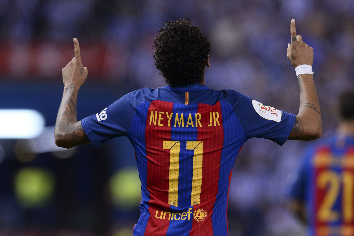 Barcelona's Brazilian forward Neymar celebrates after scoring during the Spanish Copa del Rey (King's Cup) final football match FC Barcelona vs Deportivo Alaves at the Vicente Calderon stadium in Madrid on May 27, 2017. / AFP PHOTO / Josep LAGO        (Photo credit should read JOSEP LAGO/AFP/Getty Images)
