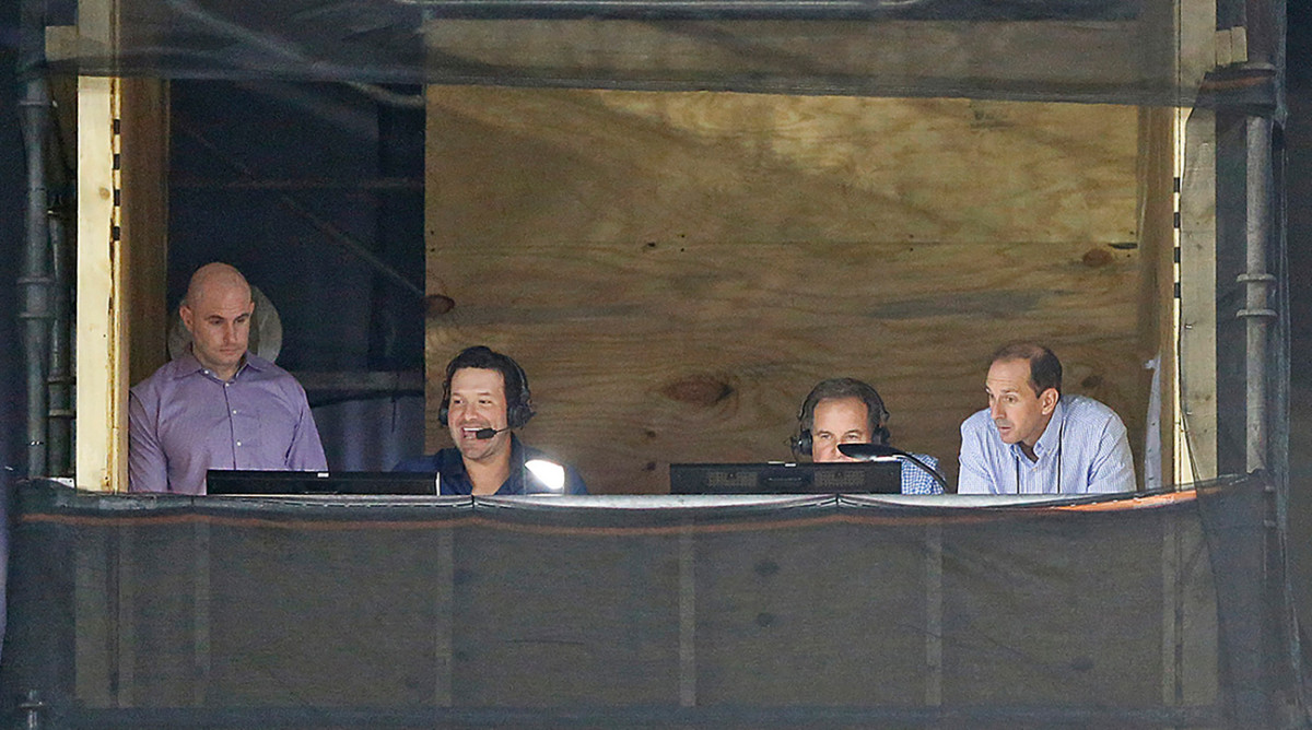 Tony Romo (second from left) debuted as an analyst in the CBS broadcast booth for Sunday’s Raiders-Titans game.