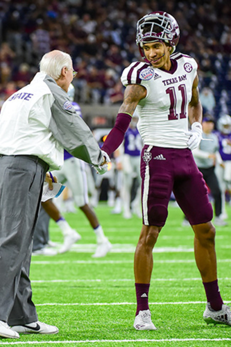 Reynolds is greeted by Bill Snyder before his final collegiate game in the Texas Bowl.