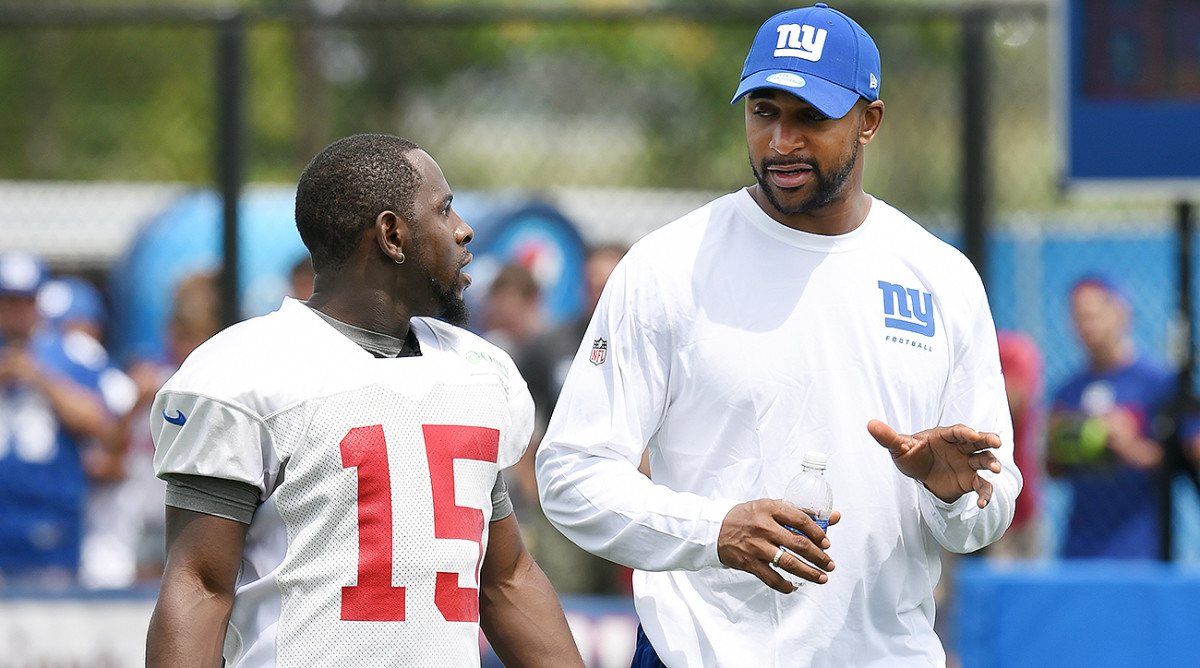 Since rejoining the Giants in 2014, Tyree (right) has become the mentor he needed often in his playing days. 