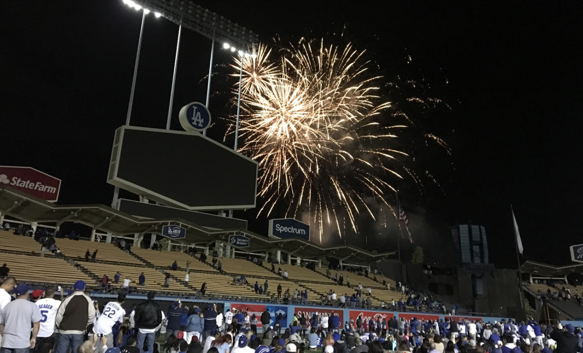 Dodger Stadium invites fans onto the outfield grass for the Friday night fireworks show.