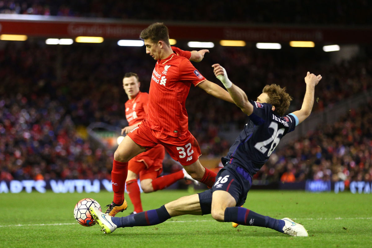 LIVERPOOL, ENGLAND - JANUARY 30:  Cameron Brannagan of Liverpool is tackled by Nikica Jelavic of West Ham United during the Emirates FA Cup Fourth Round match between Liverpool and West Ham United at Anfield on January 30, 2016 in Liverpool, England.  (Photo by Clive Brunskill/Getty Images)