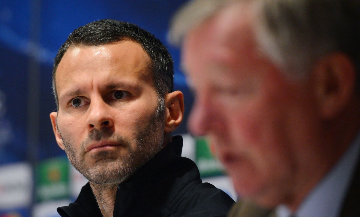 Manchester United's Welsh midfielder Ryan Giggs (L) looks on during a press conference with Manchester United manager Alex Ferguson at Old Trafford in Manchester, north-west England on March 4, 2013, on the eve of their UEFA Champions League first knockout round second leg football match against Real Madid. AFP PHOTO/ANDREW YATES        (Photo credit should read ANDREW YATES/AFP/Getty Images)