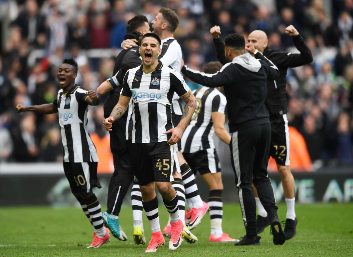 NEWCASTLE UPON TYNE, ENGLAND - MAY 07:  Aleksandar Mitrovic of Newcastle United and his Newcastle United team mates celebrate winning the title after the Sky Bet Championship match between Newcastle United and Barnsley at St James' Park on May 7, 2017 in Newcastle upon Tyne, England.  (Photo by Stu Forster/Getty Images)