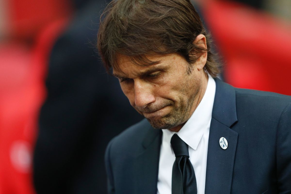 Chelsea's Italian head coach Antonio Conte reacts on the pitch after their defeat to Arsenal after the English FA Cup final football match between Arsenal and Chelsea at Wembley stadium in London on May 27, 2017.
Aaron Ramsey scored a 79th-minute header to earn Arsenal a stunning 2-1 win over Double-chasing Chelsea on Saturday and deliver embattled manager Arsene Wenger a record seventh FA Cup. / AFP PHOTO / Adrian DENNIS / NOT FOR MARKETING OR ADVERTISING USE / RESTRICTED TO EDITORIAL USE        (Photo credit should read ADRIAN DENNIS/AFP/Getty Images)