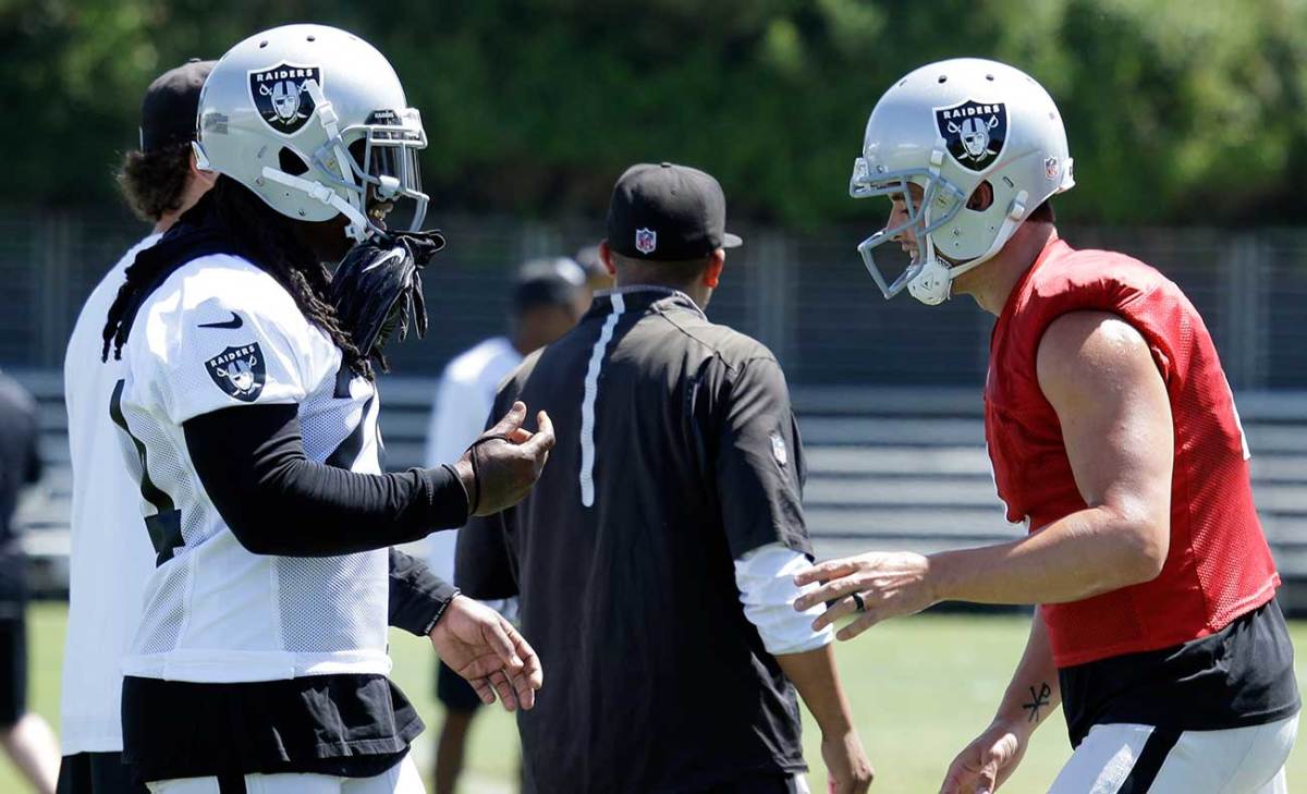 Lynch and Carr strategize at Raiders camp in Napa.