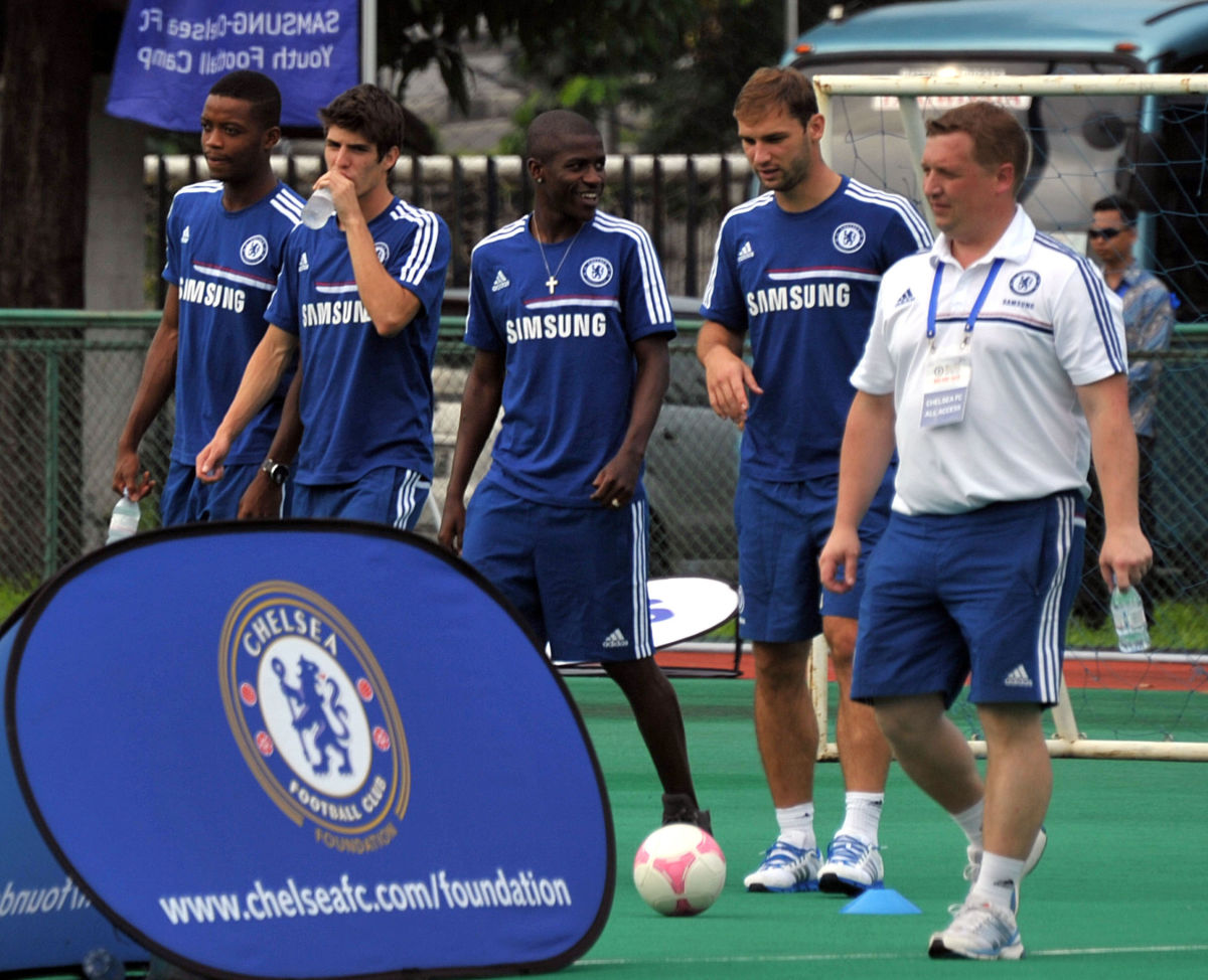 Chelsea fooball players (L to R-in blue) Nathaniel Chalobah, Lucas Piazon, Ramires and Branislav Ivanovic arrive at a coaching clinic session at the Senayan ABCD field in Jakarta on July 24, 2013. The English Premier League team will play a friendly match against the Indonesia All Stars on July 25 as part of their Asia tour.       AFP PHOTO / Bay ISMOYO        (Photo credit should read BAY ISMOYO/AFP/Getty Images)