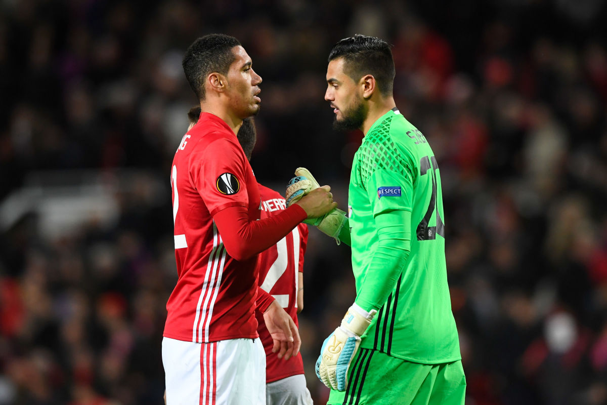 MANCHESTER, ENGLAND - MARCH 16:  Chris Smalling of Manchester United shakes hands with goalkeeper Sergio Romero of Manchester United following their team's 1-0 victory during the UEFA Europa League Round of 16, second leg match between Manchester United and FK Rostov at Old Trafford on March 16, 2017 in Manchester, United Kingdom.  (Photo by Stu Forster/Getty Images)
