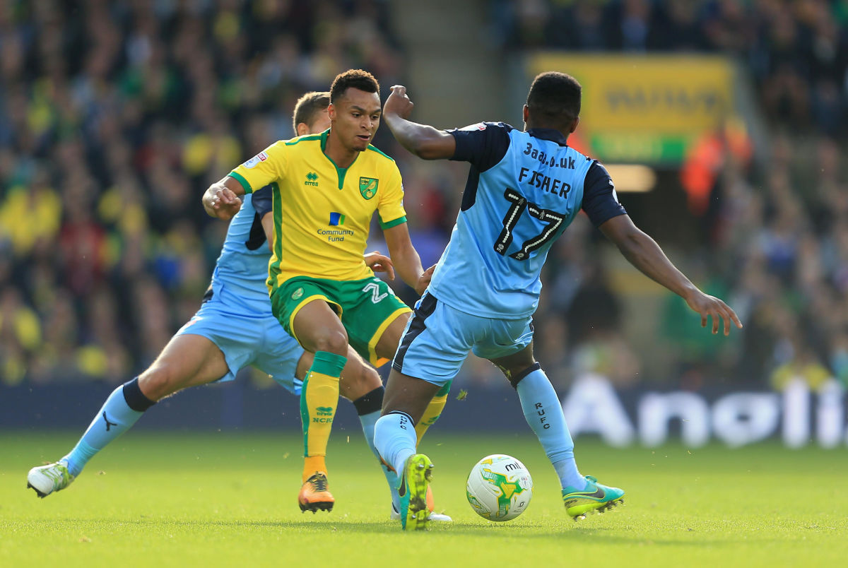 NORWICH, ENGLAND - OCTOBER 15:  Jacob Murphy of Norwich City and Darnell Fisher of Rotherham United compete for the ball during the Sky Bet Championship match between Norwich City and Rotherham United at Carrow Road on October 15, 2016 in Norwich, England. (Photo by Stephen Pond/Getty Images)