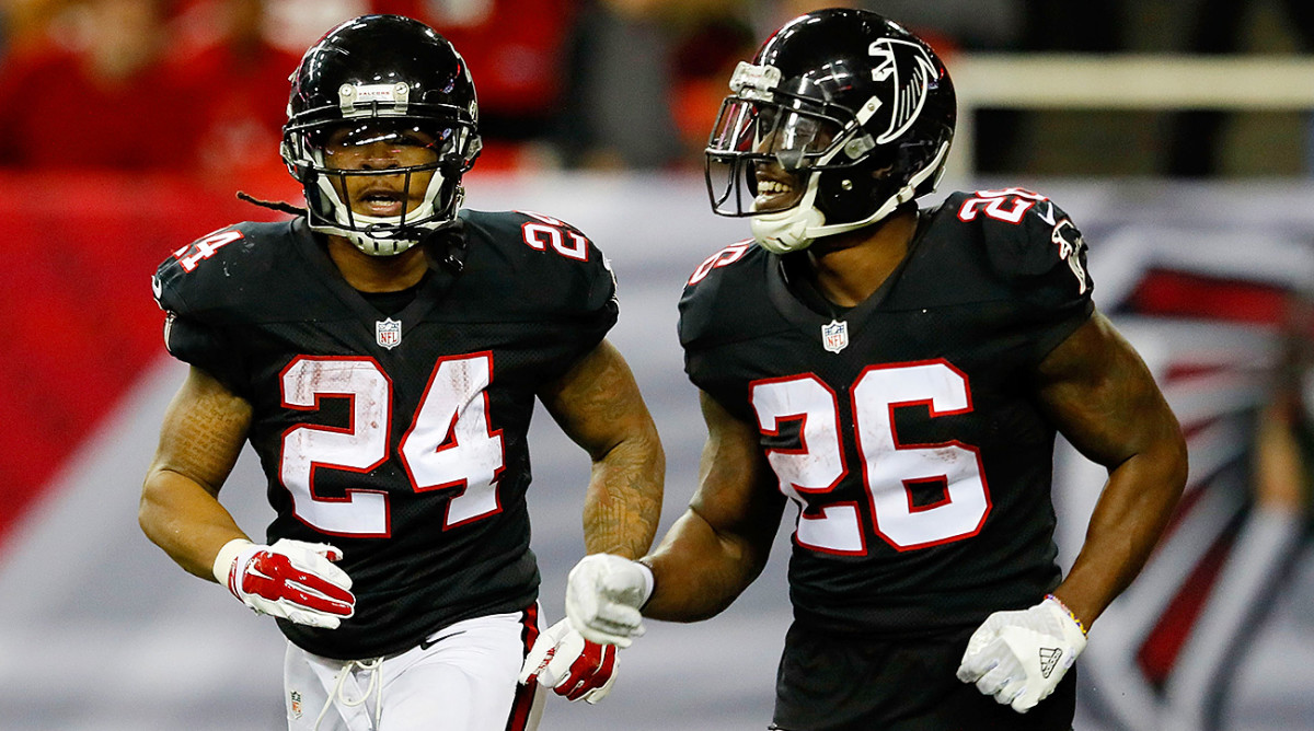 "I bond with these guys more than with my own family," says Freeman (left) of Coleman and the Falcons' deep group of skill players.