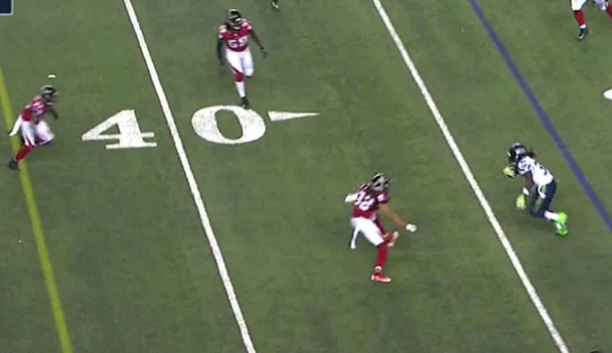 Jalen Collins (No. 32) puts pressure on Seattle RB Alex Collins (No. 36) while De'Vondre Collins (No. 59) lurks.