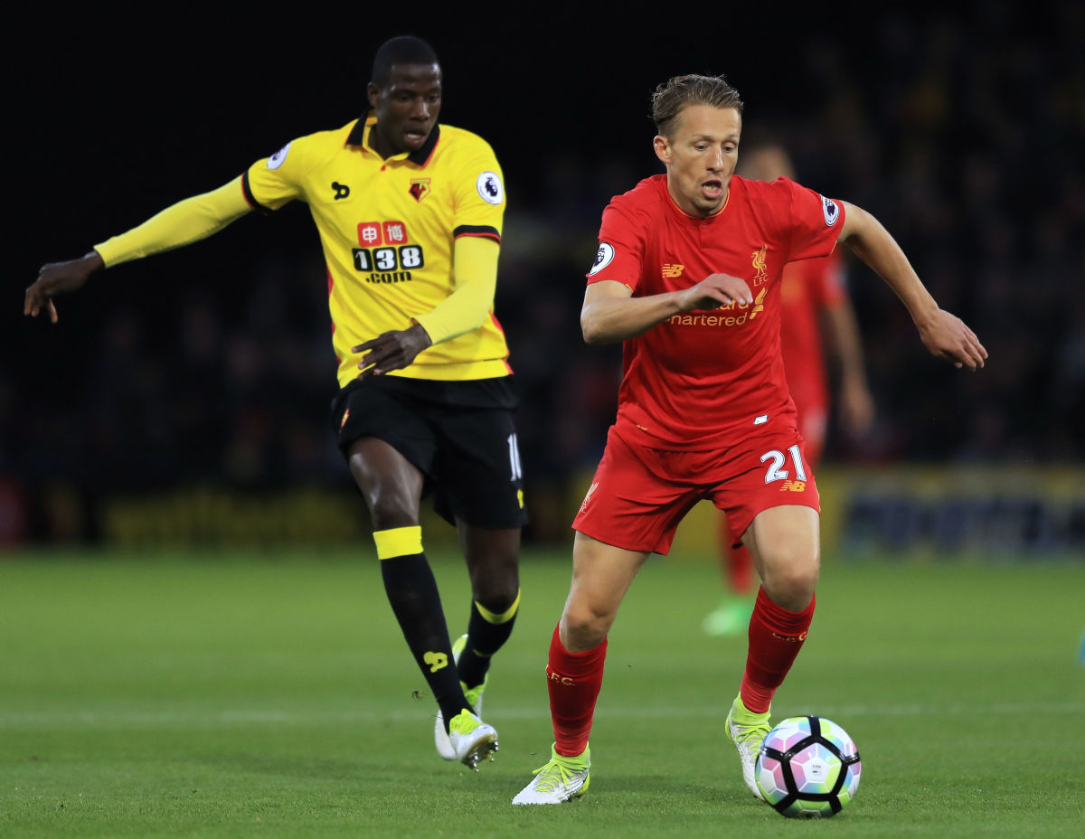 WATFORD, ENGLAND - MAY 01:  Lucas Leiva of Liverpool is pursued by Abdoulaye Doucoure of Watford during the Premier League match between Watford and Liverpool at Vicarage Road on May 1, 2017 in Watford, England.  (Photo by Richard Heathcote/Getty Images)