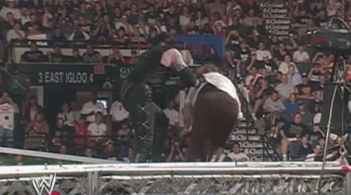 Undertaker throws Mankind Mick Foley off top of cage; Hell in a Cell