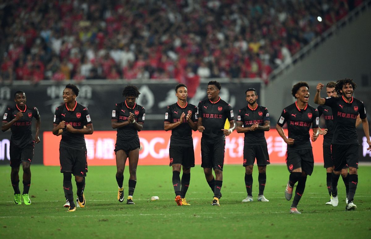 Arsenal players react after winning the penalty shootout during the International Champions Cup football match between Bayern Munich and Arsenal in Shanghai on July 19, 2017.   / AFP PHOTO / Johannes EISELE        (Photo credit should read JOHANNES EISELE/AFP/Getty Images)