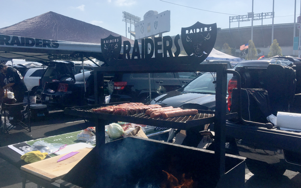 Serious grill, and grilling, outside Oakland-Alameda County Stadium. 