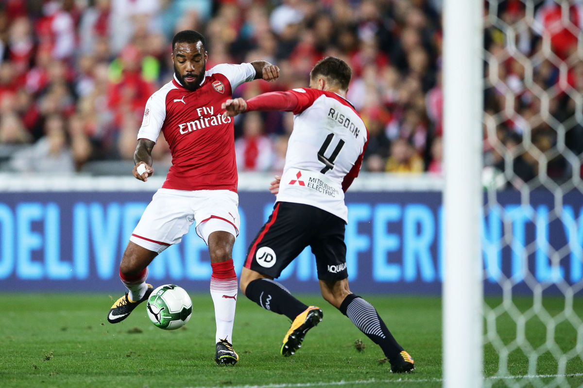 SYDNEY, AUSTRALIA - JULY 15:  Alexandre Lacazette of Arsenal is challenged by Josh Risdon of the Wanderers during the match between the Western Sydney Wanderers and Arsenal FC at ANZ Stadium on July 15, 2017 in Sydney, Australia.  (Photo by Matt King/Getty Images)