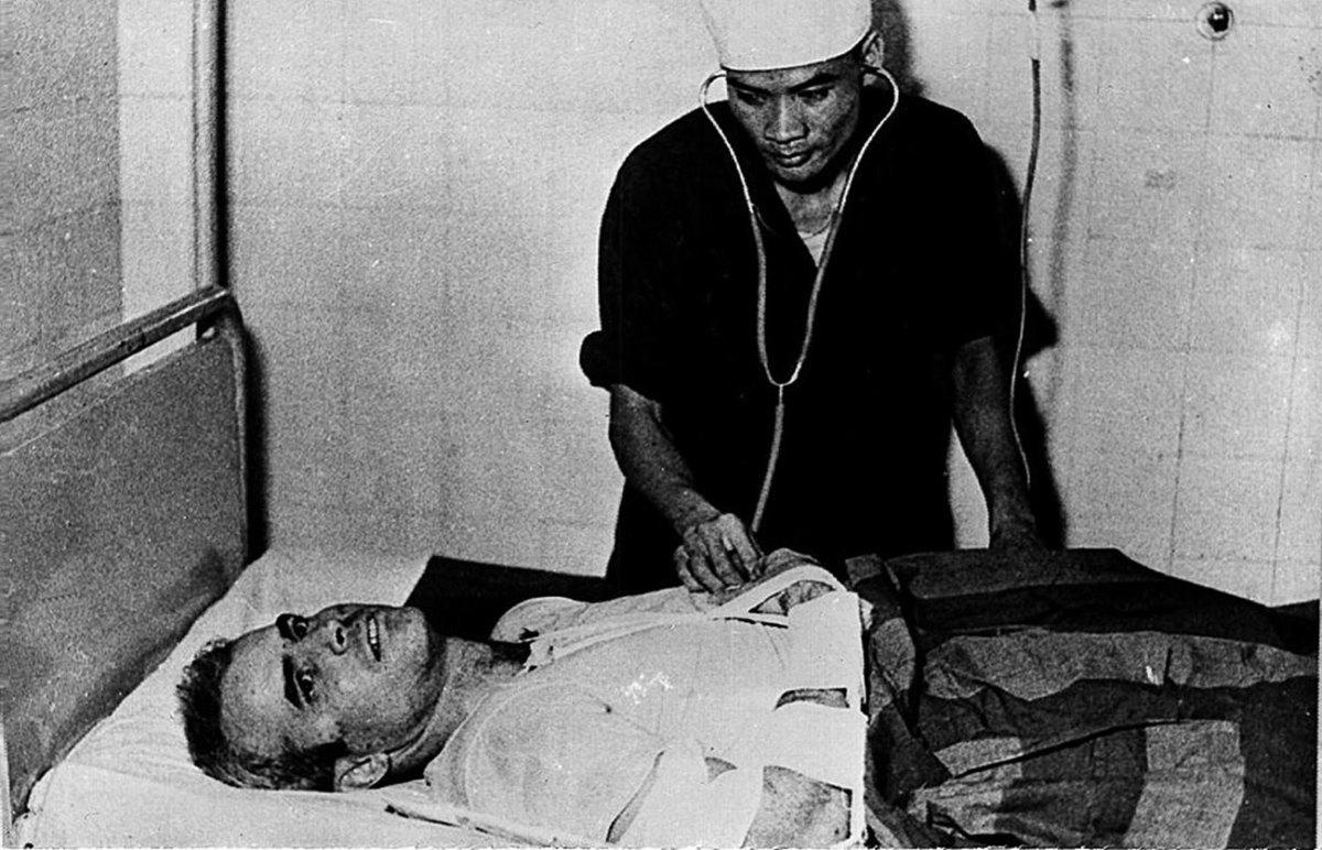 John McCain is examined by a North Vietnamese doctor after his Navy plane was shot down over Hanoi in 1967.