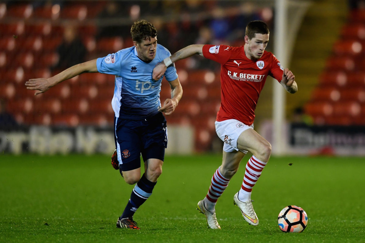 BARNSLEY, ENGLAND - JANUARY 17: Marc Roberts of Balckpool in action with Ryan Kent of Barnsley during the The Emirates FA Cup Third Round Replay between Barnsley and Blackpool at Oakwell Stadium on January 17, 2017 in Barnsley, England.  (Photo by Michael Regan/Getty Images)