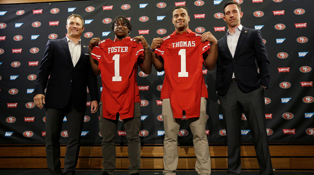 Four rookies for the 49ers, from left: GM John Lynch, LB Reuben Foster, DE Solomon Thomas and head coach Kyle Shanahan.