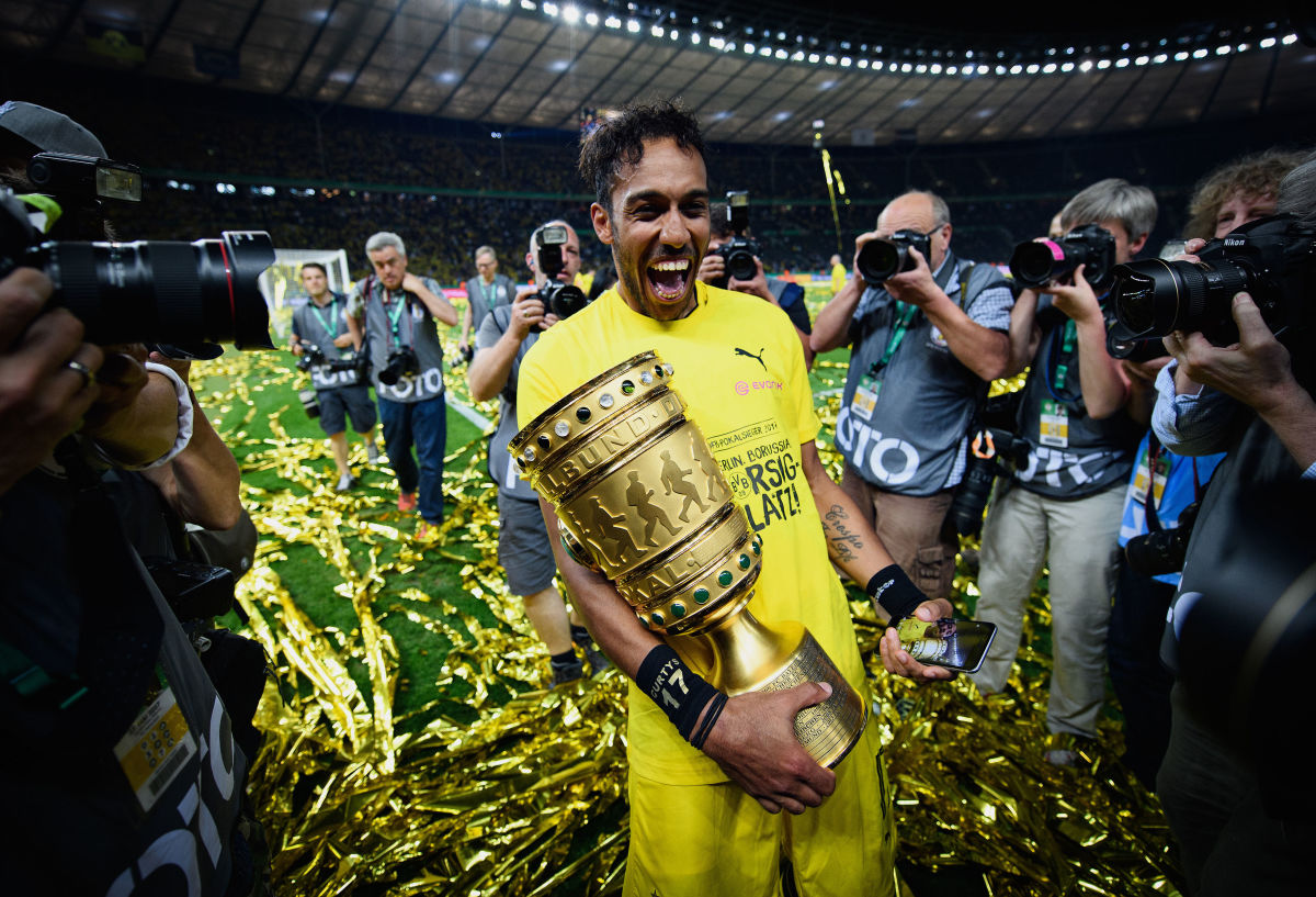 BERLIN, GERMANY - MAY 27:  Pierre-Emerick Aubameyang of Dortmund celebrates with the trophy after winning the DFB Cup Final 2017 between Eintracht Frankfurt and Borussia Dortmund at Olympiastadion on May 27, 2017 in Berlin, Germany.  (Photo by Matthias Hangst/Bongarts/Getty Images)