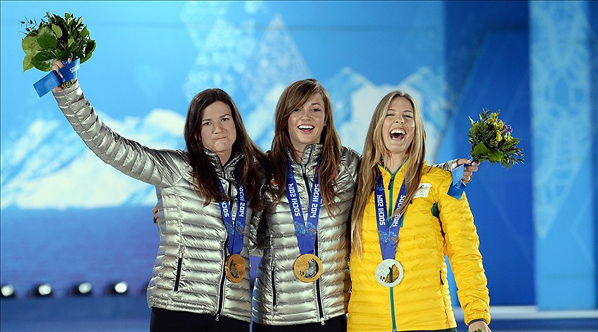 Clark (L), joined by Kaitlyn Farrington of the US (C) and Torah Bright of Australia (L) in Sochi, Russia during the 2014 Winter Olympic Games. Clark won the bronze medal, with Farrington winning the gold and Bright the silver.