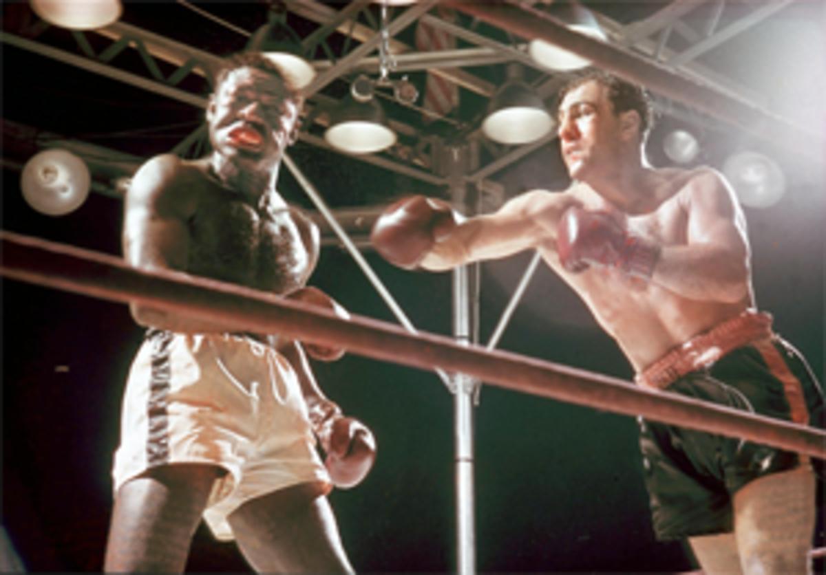 Rocky Marciano (r.) in a heavyweight title bout against Ezzard Charles at Yankee Stadium in 1954.