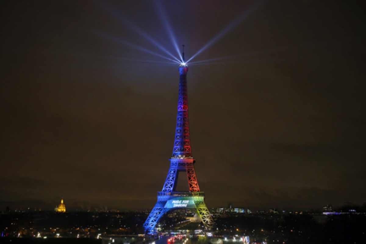FILE- In this Friday, Feb. 3, 2017 file photo, the Eiffel Tower is lit with colors for the Paris 2024 during the launch of the international campaign of Paris as candidate for the 2024 Olympic summer games in Paris. An International Olympic Committee pane