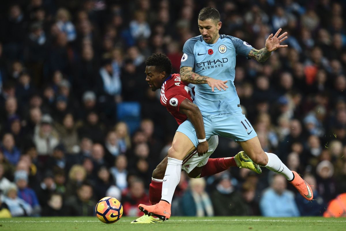 Middlesbrough's Spanish midfielder Adama Traore (L) challenges Manchester City's Serbian defender Aleksandar Kolarov (R) during the English Premier League football match between Manchester City and Middlesbrough at the Etihad Stadium in Manchester, north west England, on November 5, 2016. / AFP / OLI SCARFF / RESTRICTED TO EDITORIAL USE. No use with unauthorized audio, video, data, fixture lists, club/league logos or 'live' services. Online in-match use limited to 75 images, no video emulation. No use in betting, games or single club/league/player publications.  /         (Photo credit should read OLI SCARFF/AFP/Getty Images)