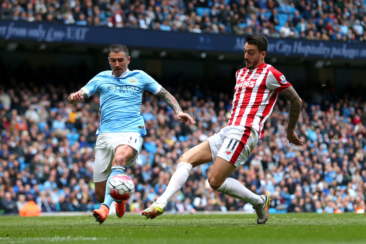 MANCHESTER, ENGLAND - APRIL 23: Aleksandar Kolarov of Manchester City closes down Joselu of Stoke City during the Barclays Premier League match between Manchester City and Stoke City at Etihad Stadium on April 23, 2016 in Manchester, United Kingdom.  (Photo by Chris Brunskill/Getty Images)