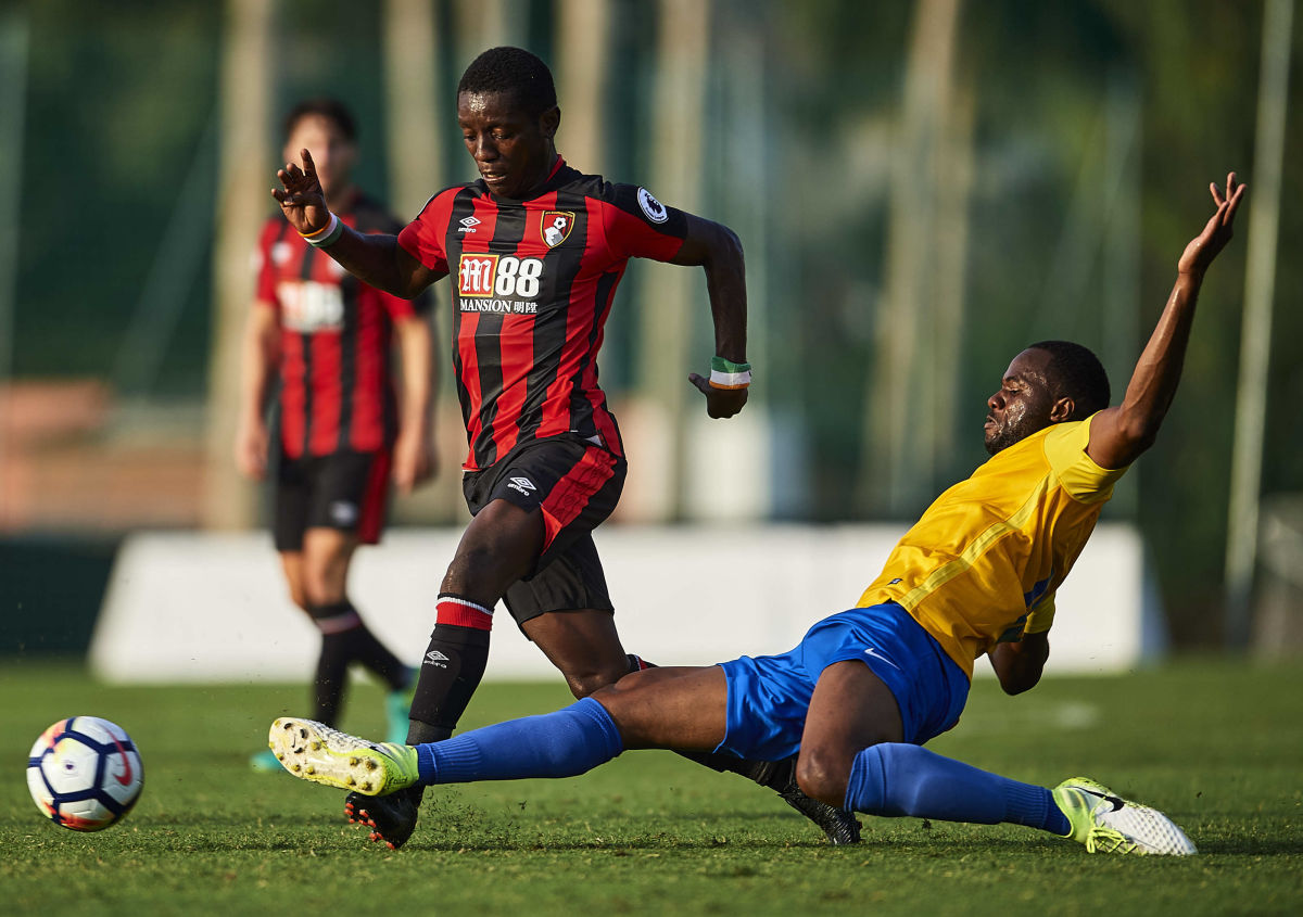 MARBELLA, SPAIN - JULY 15:  Max Gradel of AFC Bournemouth (L) being followed by Omar Diakhite of Estoril Praia (R) during a Pre Season Friendly match between AFC Bournemouth and Estoril Praia at the Marbella Football Center on July 15, 2017 in Marbella, Spain.  (Photo by Aitor Alcalde/Getty Images)