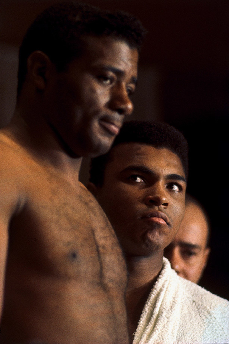 25 years later ali and frazier are still slugging it out sports illustrated