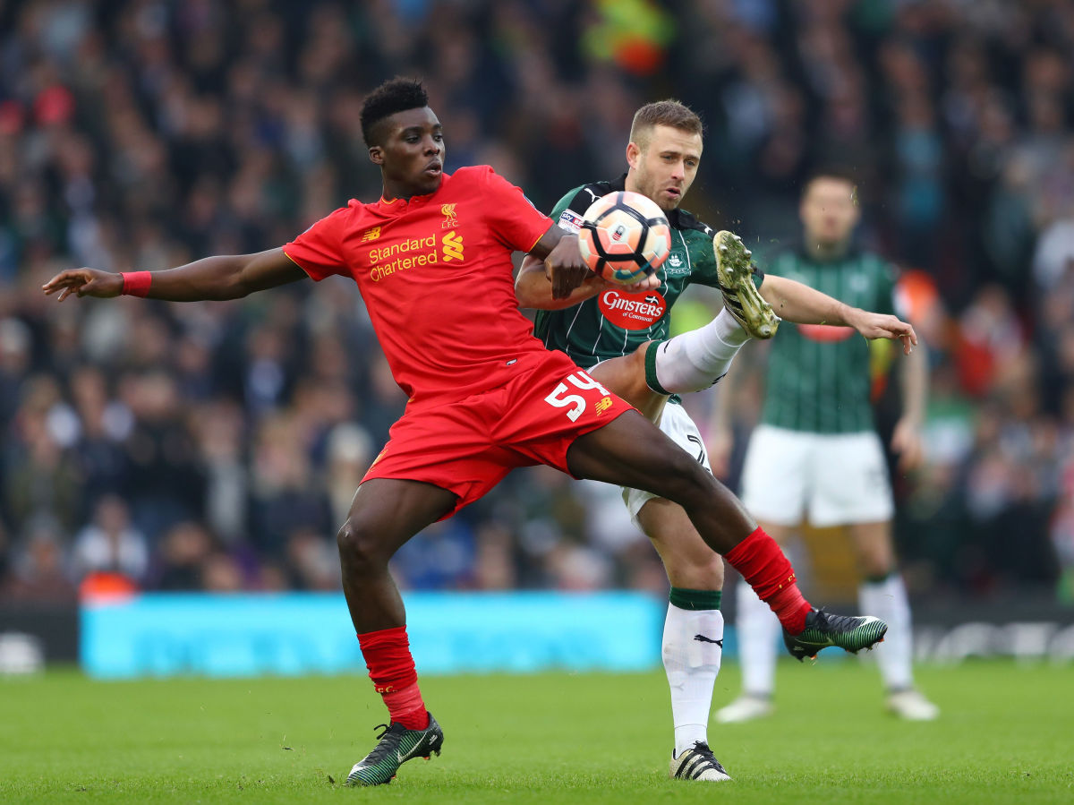 LIVERPOOL, ENGLAND - JANUARY 08: Sheyi Ojo of Liverpool (L) and David Fox of Plymouth Argyle (R) battle for possession during The Emirates FA Cup Third Round match between Liverpool and Plymouth Argyle at Anfield on January 8, 2017 in Liverpool, England.  (Photo by Michael Steele/Getty Images)