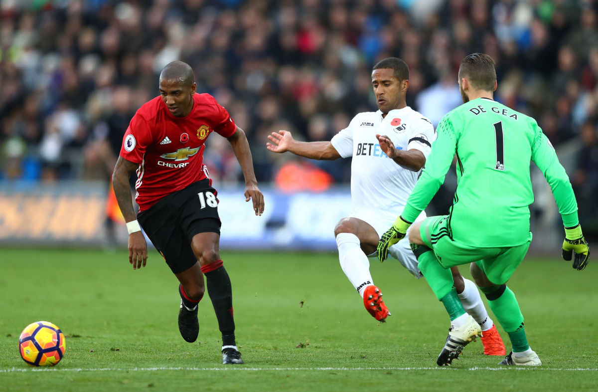 SWANSEA, WALES - NOVEMBER 06:  Wayne Routledge of Swansea City and Ashley Young of Manchester United chase down the ball during the Premier League match between Swansea City and Manchester United at Liberty Stadium on November 6, 2016 in Swansea, Wales.  (Photo by Michael Steele/Getty Images)