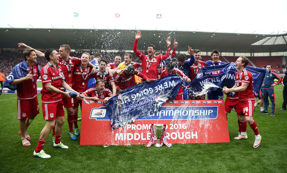 MIDDLESBROUGH, ENGLAND - MAY 07:  Middlesbrough players celebrate their promotion to the Premier League after the Sky Bet Championship match between Middlesbrough and Brighton and Hove Albion at the Riverside Stadium on May 7, 2016 in Middlesbrough, United Kingdom.  (Photo by Chris Brunskill/Getty Images)