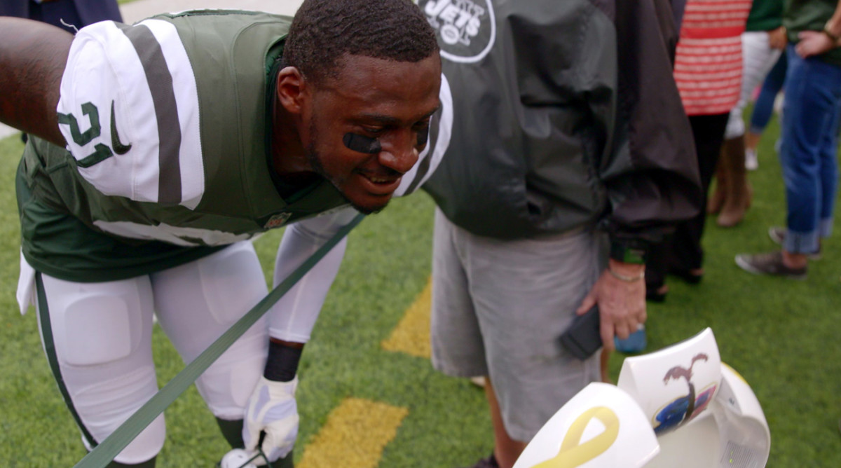 Morris Claiborne chats with Jack through the sideline robot, before the game.