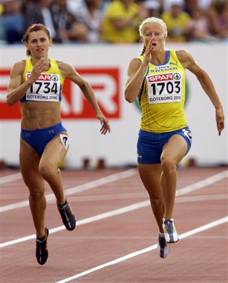 FILE In this Monday Aug. 7, 2006 file photo Lyudmyla Blonska of Ukraine, left, and Sweden's Carolina Kluft compete in the Heptathlon 200 meters at the European Athletics Championships in Goteborg, Sweden. A plan to offer amnesty to Ukrainian track and fie