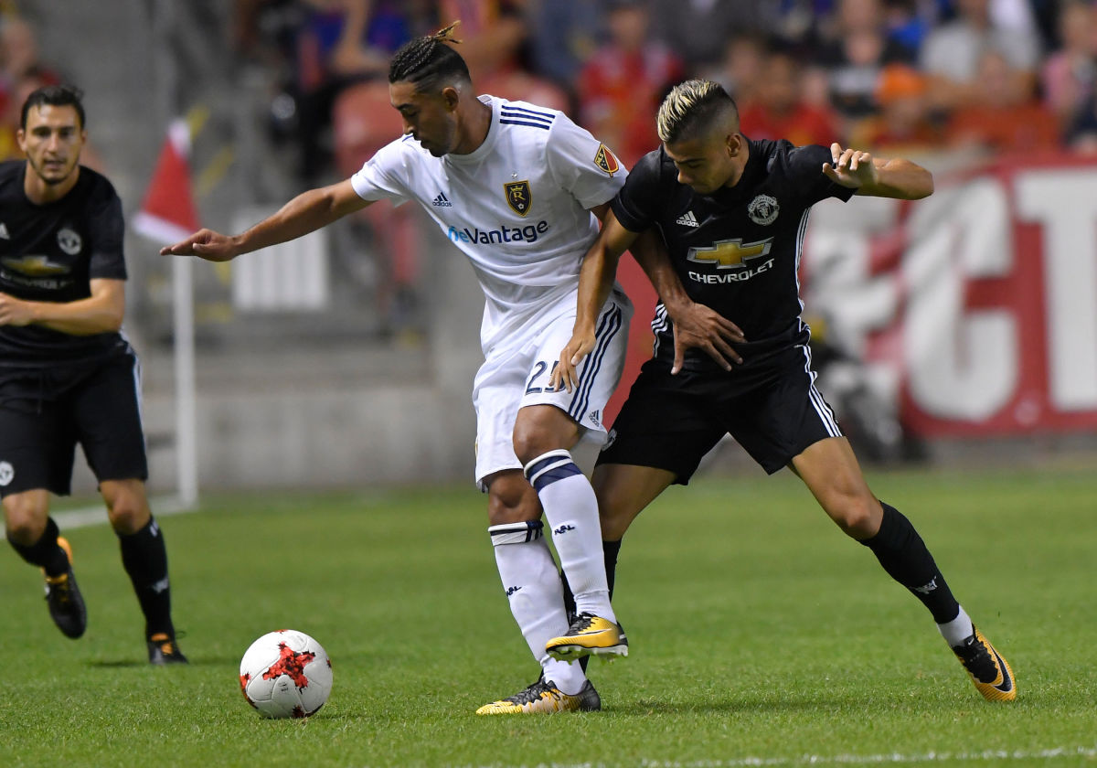 SANDY UT- JULY 17: Danilo Acosta #25 of Real Salt Lake fights for the ball with Andreas Pereira #15 of Manchester United during the second half of the International friendly game at Rio Tinto Stadium on July 17, 2017 in Sandy, Utah.  Manchester United won 2-1. (Photo by Gene Sweeney Jr/Getty Images)