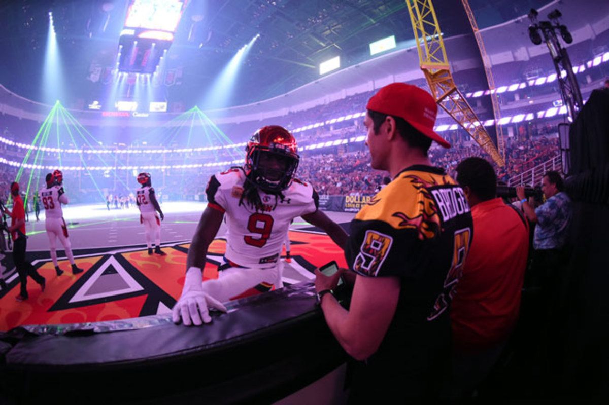 Bledsoe interviews a Jacksonville player just before the game begins.
