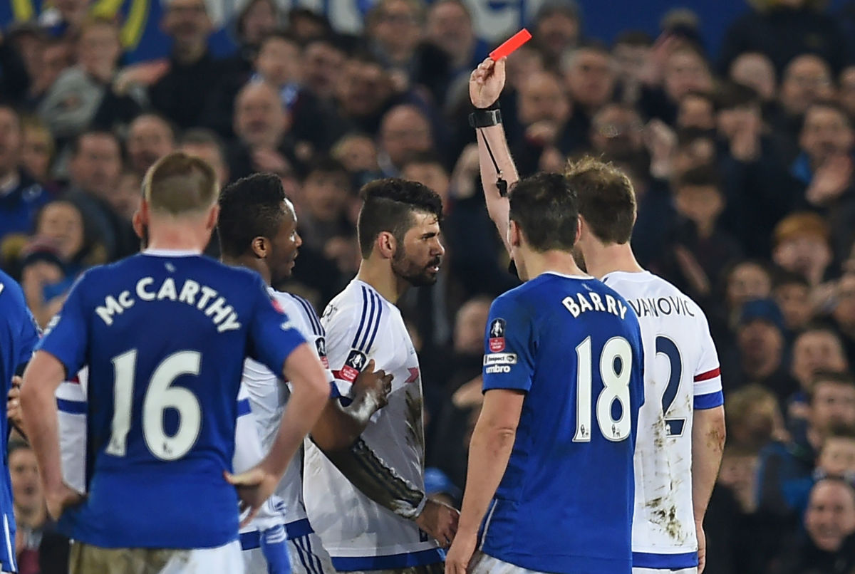 Chelsea's Brazilian-born Spanish striker Diego Costa (C) is shown a red card by referee Michael Oliver during the English FA cup quarter-final football match between Everton and Chelsea at Goodison Park in Liverpool, north west England on March 12, 2016. / AFP / Paul ELLIS / RESTRICTED TO EDITORIAL USE. No use with unauthorized audio, video, data, fixture lists, club/league logos or 'live' services. Online in-match use limited to 75 images, no video emulation. No use in betting, games or single club/league/player publications.  /         (Photo credit should read PAUL ELLIS/AFP/Getty Images)